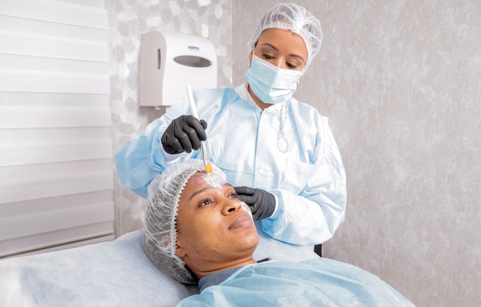 Photo by Omar Medina on Pexels A beautician applies a treatment to a woman's face in a spa, focusing on skincare. Photo by Omar Medina on Pexels
