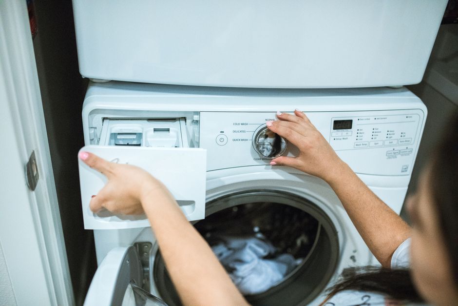 Photo by RDNE Stock project on Pexels A person in a laundry room adjusting settings on a washing machine. Photo by RDNE Stock project on Pexels