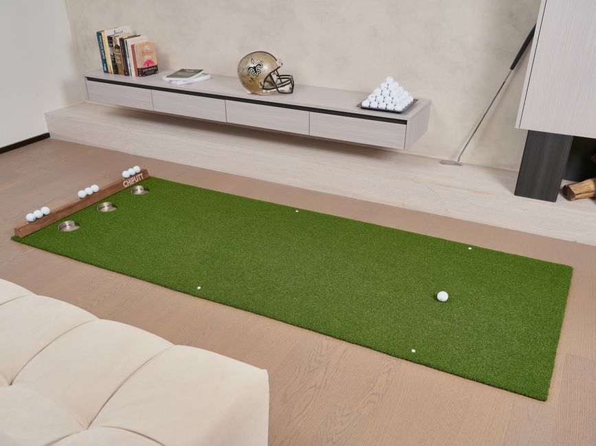 Photo by Chiputt Golf on Pexels Indoor putting green with golf balls and equipment, perfect for practice at home. Photo by Chiputt Golf on Pexels