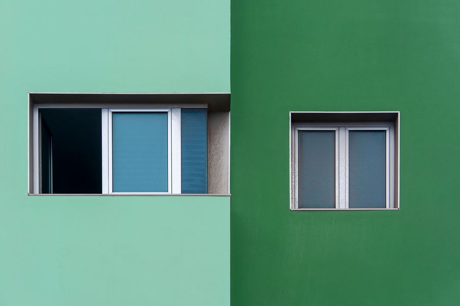 Photo by Jan van der Wolf on Pexels Minimalist facade showcasing two windows on contrasting green walls. Photo by Jan van der Wolf on Pexels