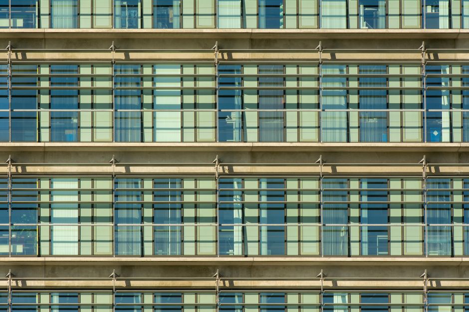 Photo by Jan van der Wolf on Pexels Close-up of a modern building facade with repetitive grid pattern and glass windows. Photo by Jan van der Wolf on Pexels