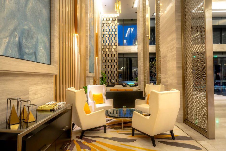 Bright hotel lobby with armchairs and a seating area. Photo by Quang Nguyen Vinh on Pexels