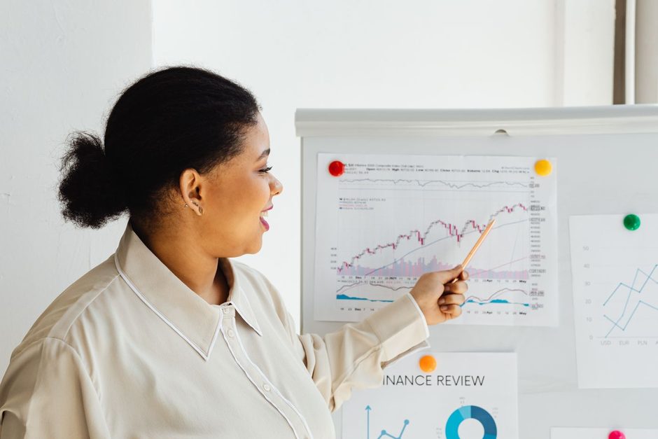 Photo by https://kaboompics.com/ on Pexels Analyst pointing at charts on a whiteboard during a marketing review. Photo by https://kaboompics.com/ on Pexels