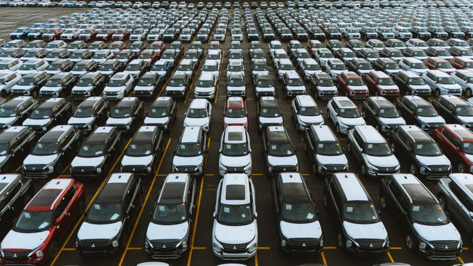 Photo by Luke Miller on Pexels Aerial shot showcasing a vast storage lot filled with parked cars lined up in rows. Photo by Luke Miller on Pexels