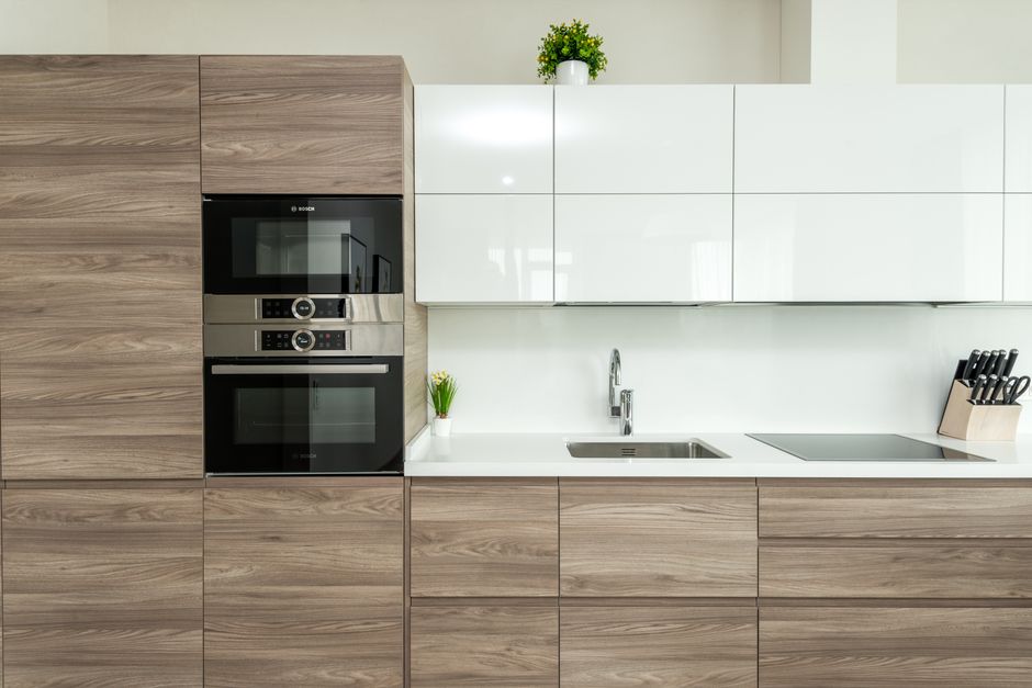 Photo by Max Vakhtbovych on Pexels Interior of modern kitchen with white and wooden minimalist cabinets and built in appliances in apartment. Photo by Max Vakhtbovych on Pexels