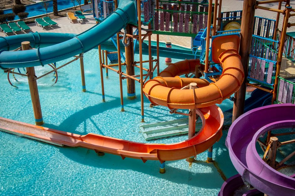 Photo by Vika Glitter on Pexels Vibrant water park slides offering fun in the sun for the whole family. Photo by Vika Glitter on Pexels