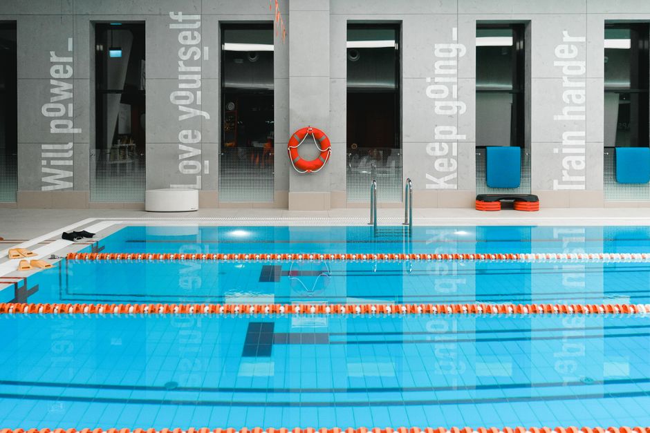 Photo by SHVETS production on Pexels A modern indoor swimming pool with motivational quotes on the walls and clear water. Photo by SHVETS production on Pexels