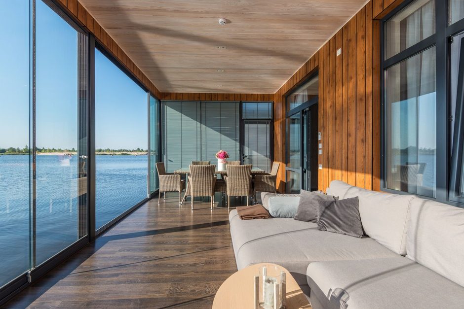 Photo by Max Vakhtbovych on Pexels Bright holiday rental interior with timber floor and large windows over water. Photo by Max Vakhtbovych on Pexels