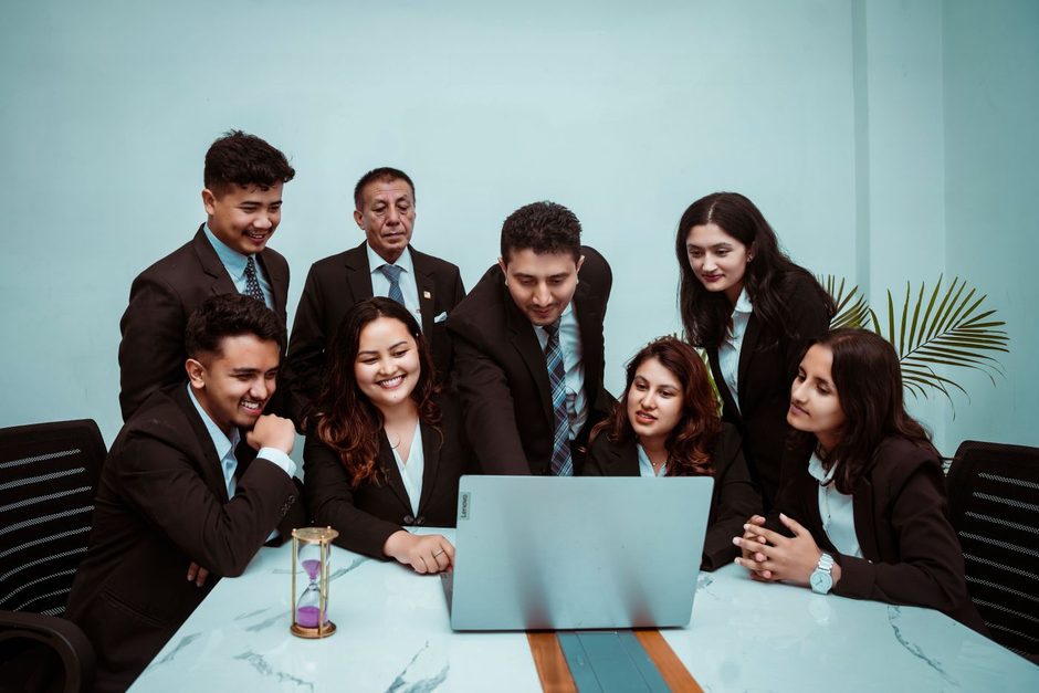 Photo by Bhandari Law and Partners on Pexels Diverse team gathered around a laptop in a bright meeting room. Photo by Bhandari Law and Partners on Pexels