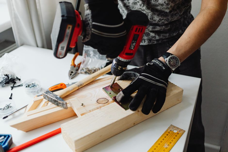 Photo by https://kaboompics.com/ on Pexels A craftsman uses a power drill on wood, showcasing carpentry tools and skills. Photo by https://kaboompics.com/ on Pexels