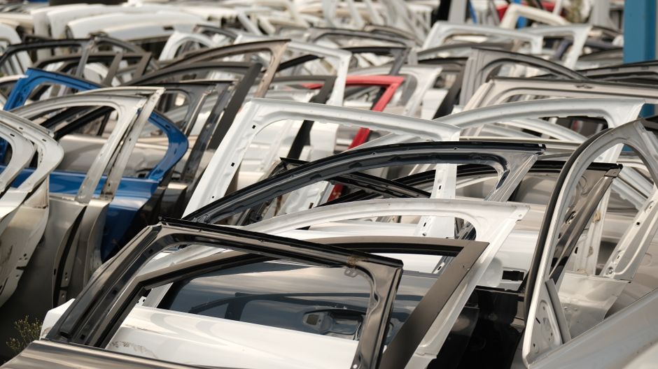 Photo by Aziz Er on Pexels A variety of car doors in different colors arranged in a junkyard setting. Photo by Aziz Er on Pexels