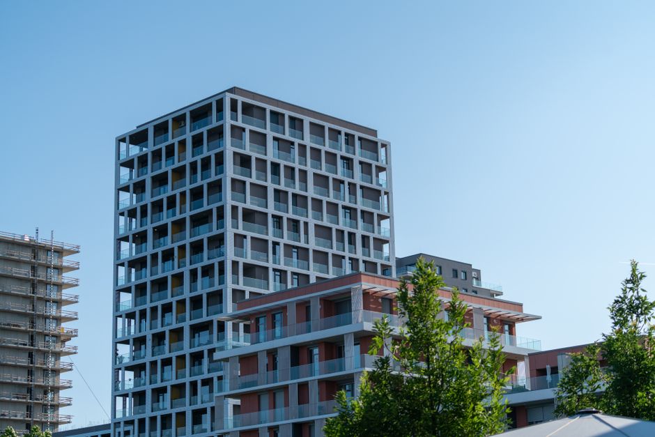 Photo by Tibor Szabo on Pexels Contemporary residential buildings against a bright blue sky, showcasing modern design. Photo by Tibor Szabo on Pexels