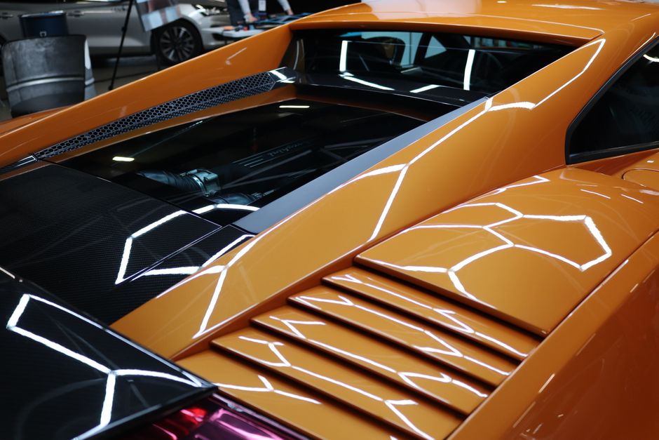 Photo by Loïc Manegarium on Pexels Detailed image of a yellow sports car engine area with reflective surfaces and sleek design. Photo by Loïc Manegarium on Pexels