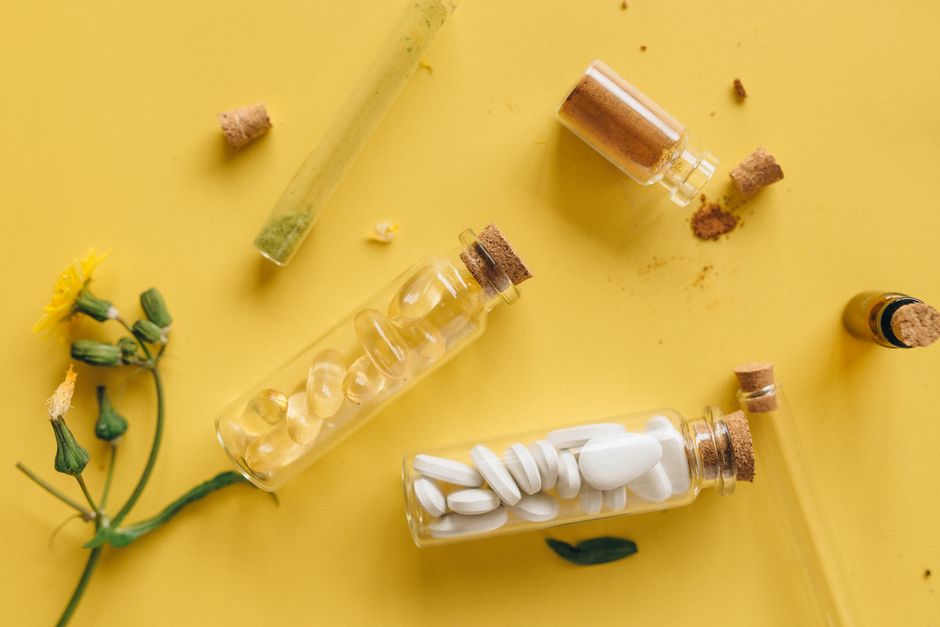 Photo by Nataliya Vaitkevich on Pexels Top view of medicinal herbs, pills, and powders in bottles against a vibrant yellow backdrop. Photo by Nataliya Vaitkevich on Pexels