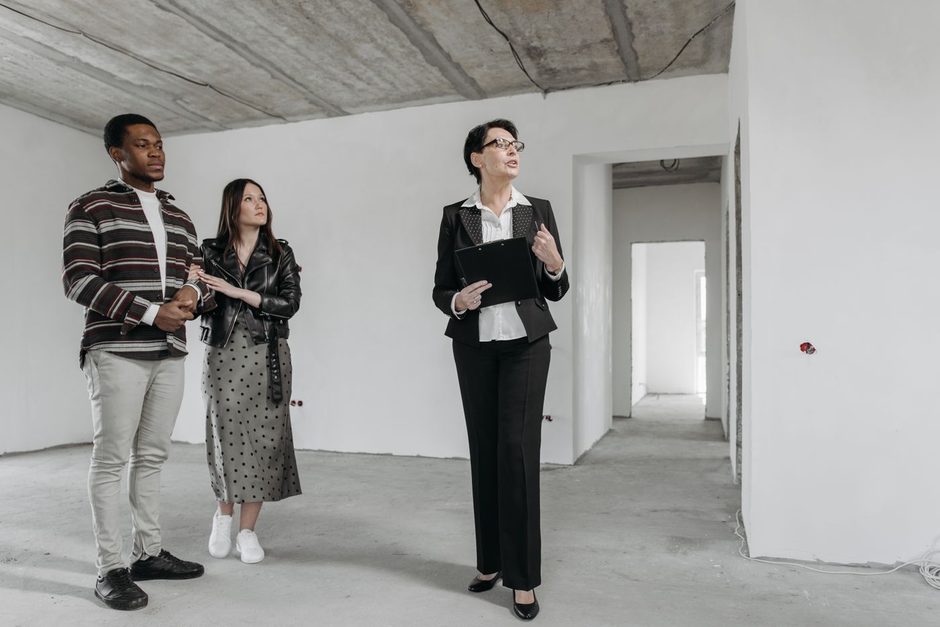 Photo by Pavel Danilyuk on Pexels Property agent showing an empty apartment to a couple. Photo by Pavel Danilyuk on Pexels