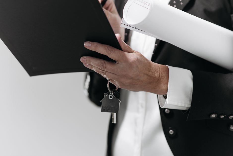 Photo by Pavel Danilyuk on Pexels Close-up of a business professional holding a house key and architectural plans, symbolizing real estate. Photo by Pavel Danilyuk on Pexels