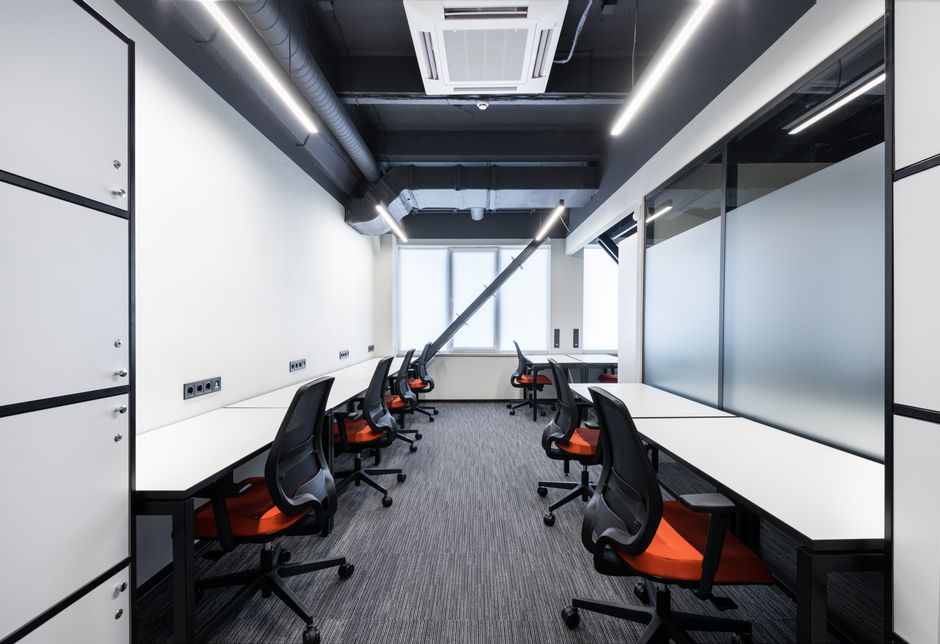 Photo by Max Vakhtbovych on Pexels White desks with comfortable colorful chairs placed in spacious workspace with window and glass partitions in contemporary financial business center. Photo by Max Vakhtbovych on Pexels