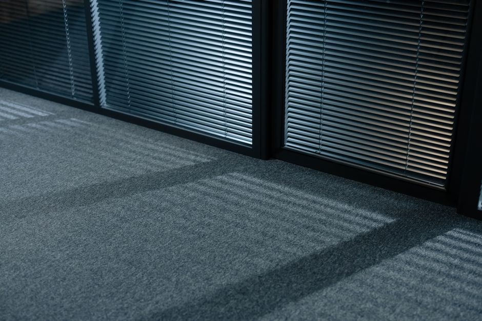 Photo by cottonbro studio on Pexels A serene indoor space with shadows and venetian blinds casting lines on a carpeted floor. Photo by cottonbro studio on Pexels