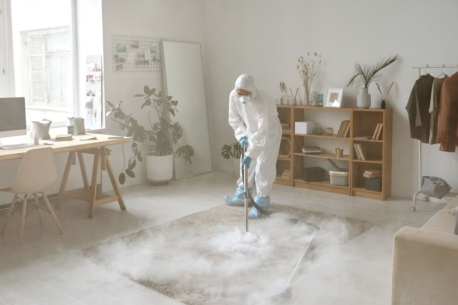 Photo by Michelangelo Buonarroti on Pexels A person in protective gear disinfects a room with smoke, ensuring safety against germs. Photo by Michelangelo Buonarroti on Pexels