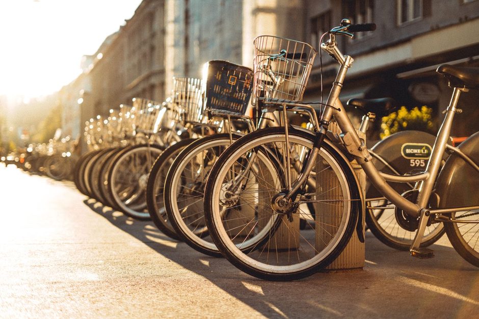 Photo by Antonio Pereira on Pexels Row of rental bicycles parked in warm afternoon light. Photo by Antonio Pereira on Pexels