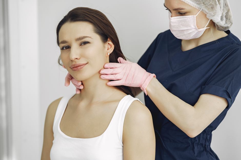 Photo by Gustavo Fring on Pexels A medical practitioner in scrub suit performs a neck examination on a smiling woman in a clinic. Photo by Gustavo Fring on Pexels