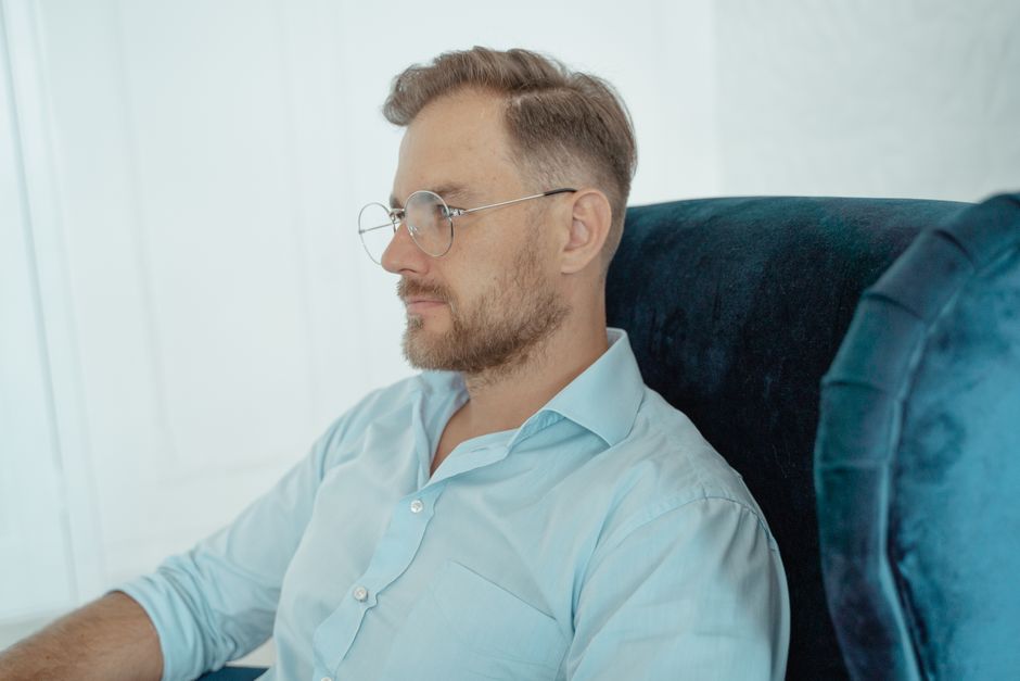 Photo by Tima Miroshnichenko on Pexels Side view of a bearded man wearing glasses, sitting indoors in a casual setting. Photo by Tima Miroshnichenko on Pexels