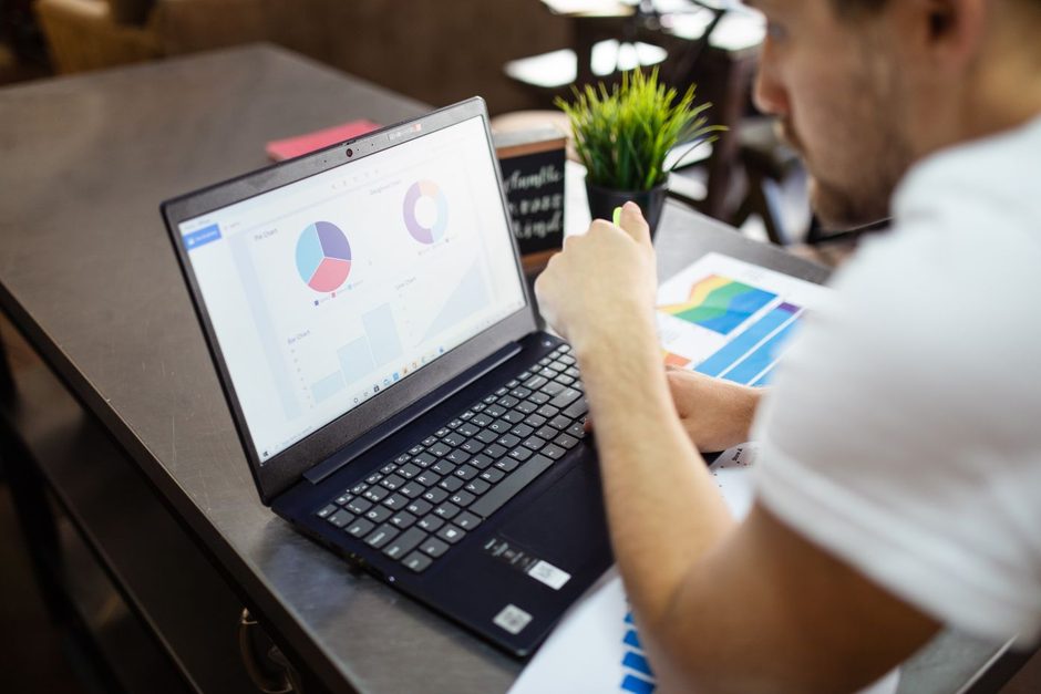 Marketer viewing an analytics dashboard on a laptop with a plant nearby. Photo by RDNE Stock project on Pexels