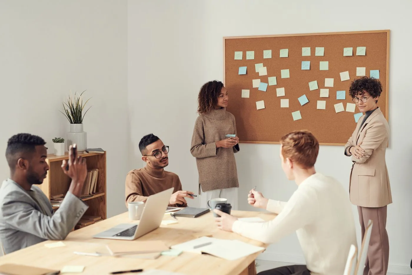 Senior consultants in a professional boardroom meeting. Photo by fauxels on Pexels