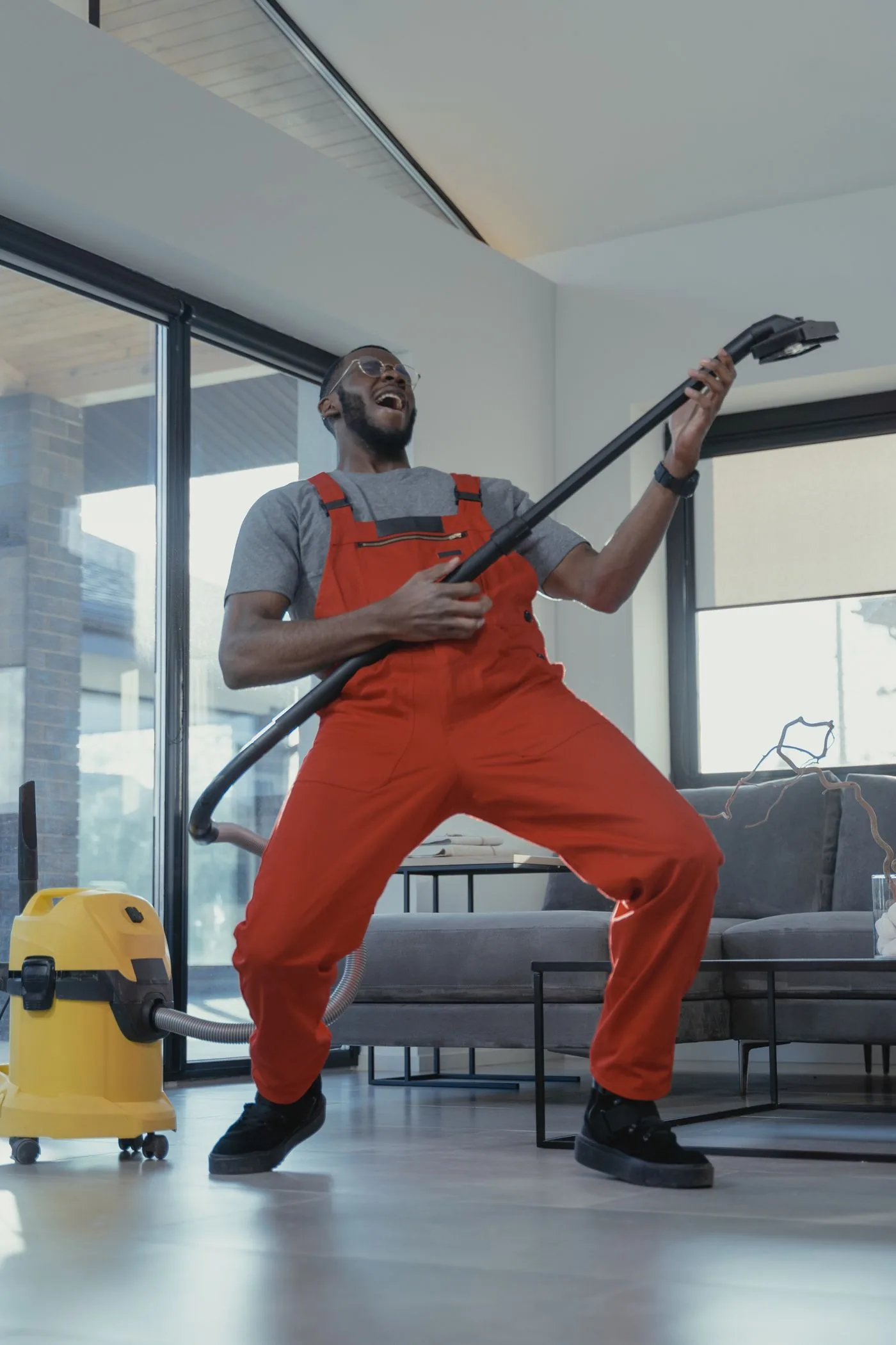 Paving and Driveways — Professional cleaner vacuuming during a residential service visit