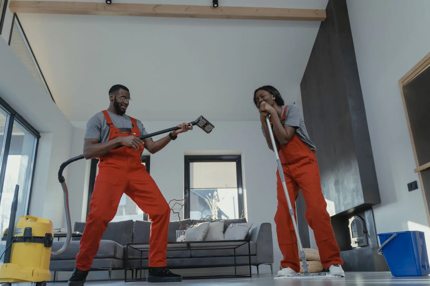 Two cleaners working a multi-room commercial site