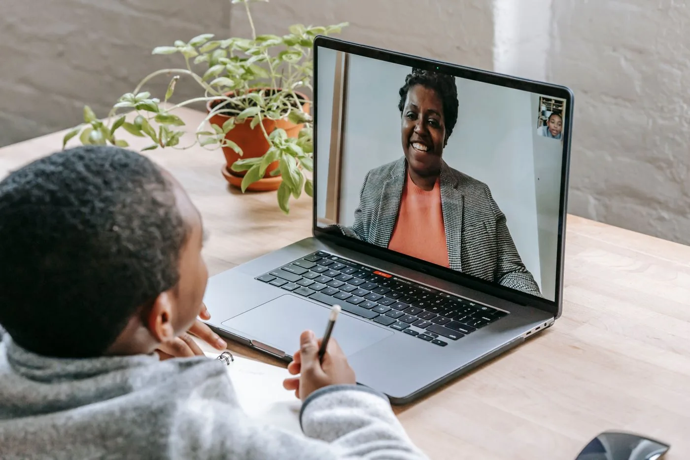 Learner on a video call with a trusted tutor. Photo by Katerina Holmes on Pexels