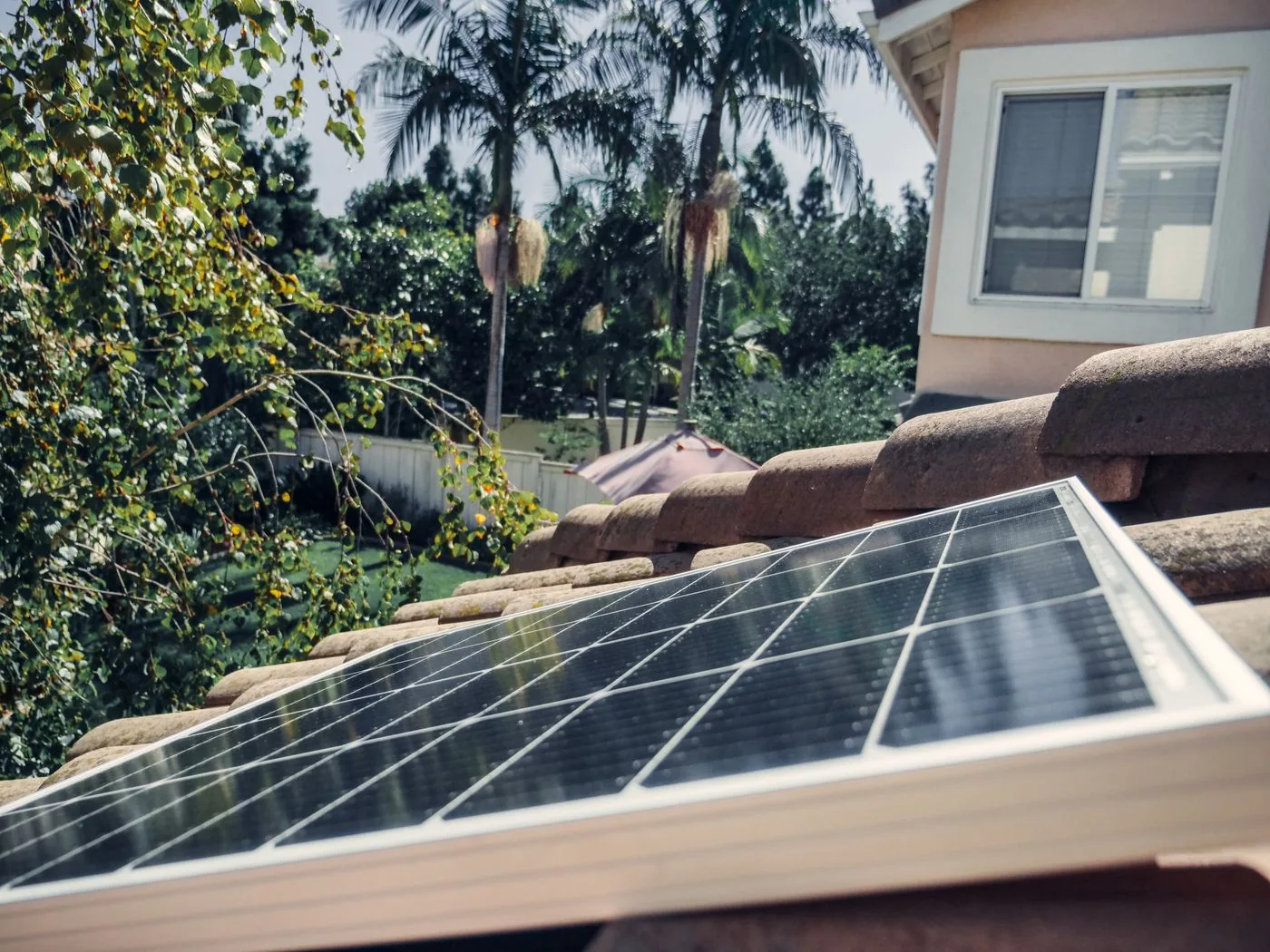EV Charger Installation — Residential rooftop solar panel installed on clay tiles