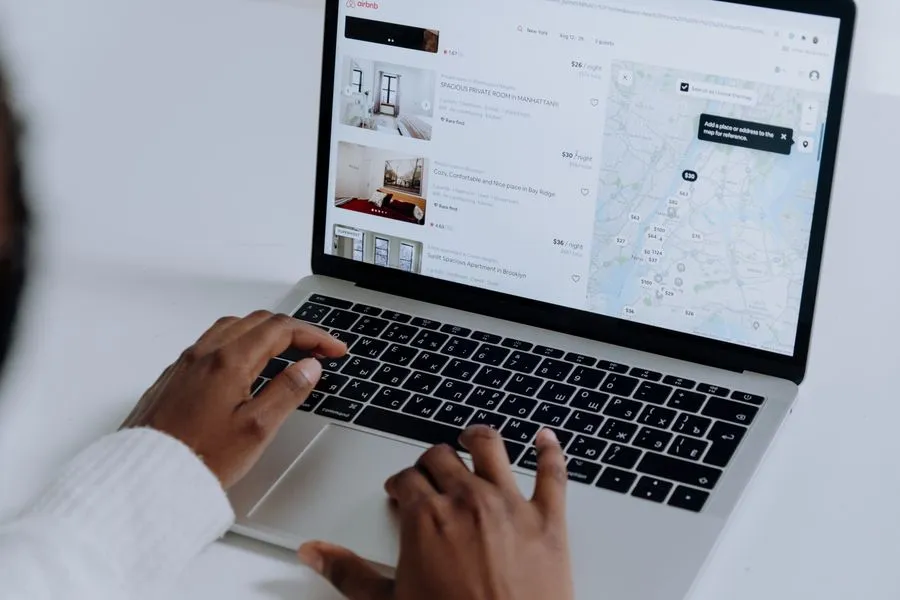Homebuyer browsing property listings on a laptop. Photo by cottonbro studio on Pexels