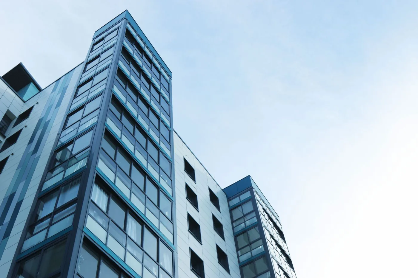 Intercoms — Modern commercial office building exterior for access control marketing