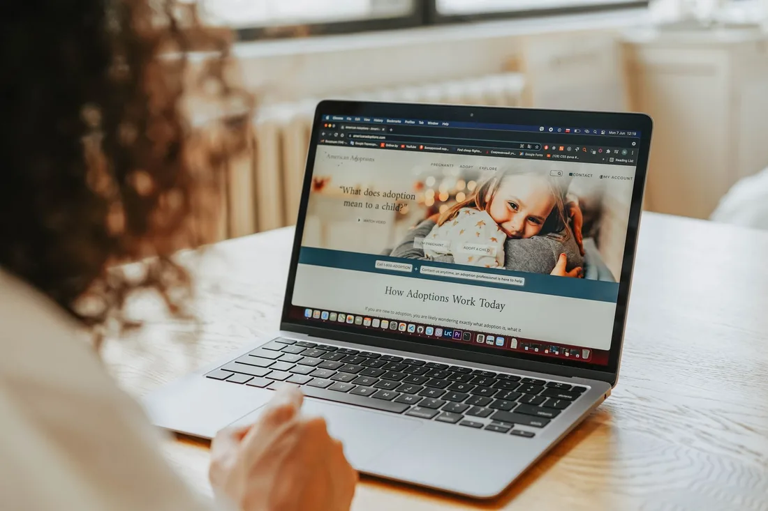 Website displayed on an open laptop on a white desk. Photo by olia danilevich on Pexels