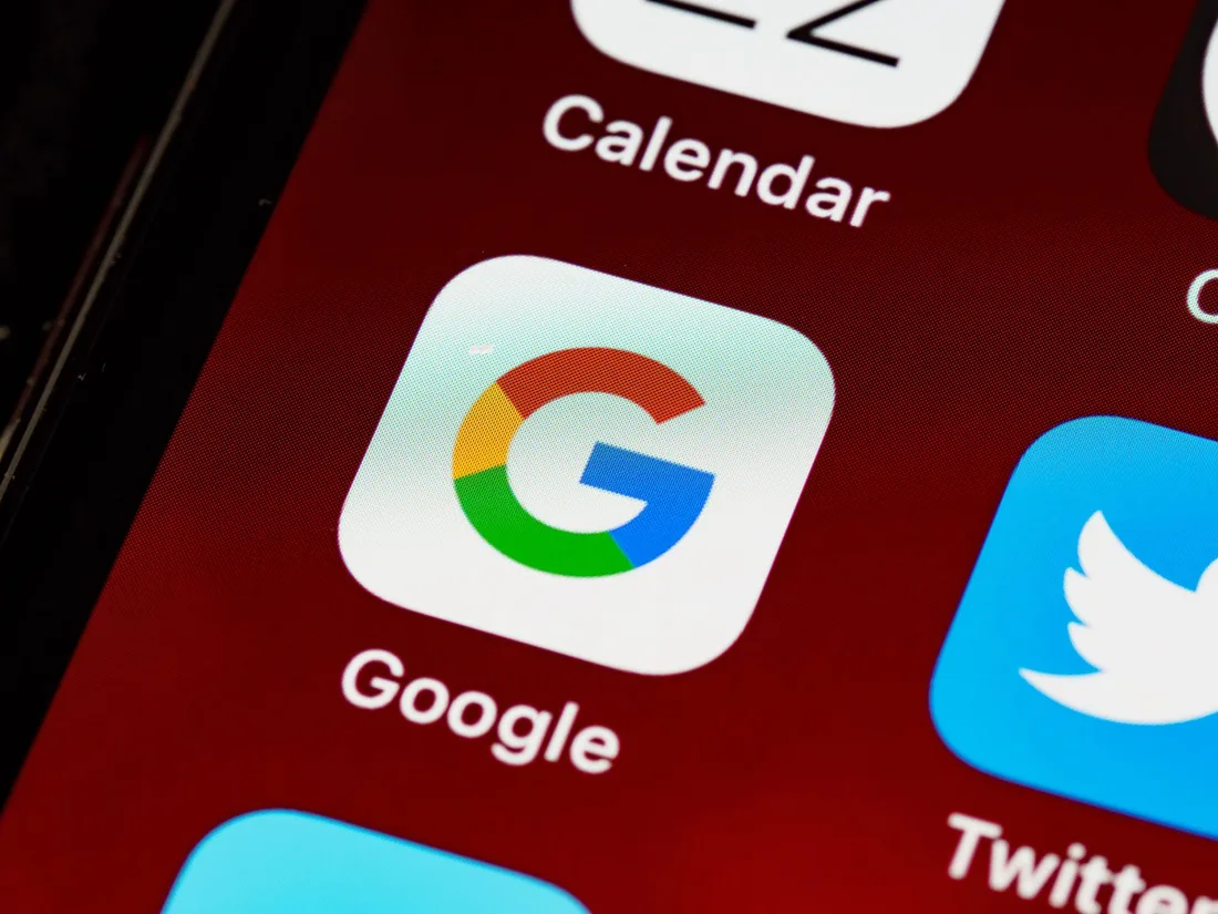 Macro view of a smartphone displaying Google and other app icons on the home screen. Photo by Brett Jordan on Pexels