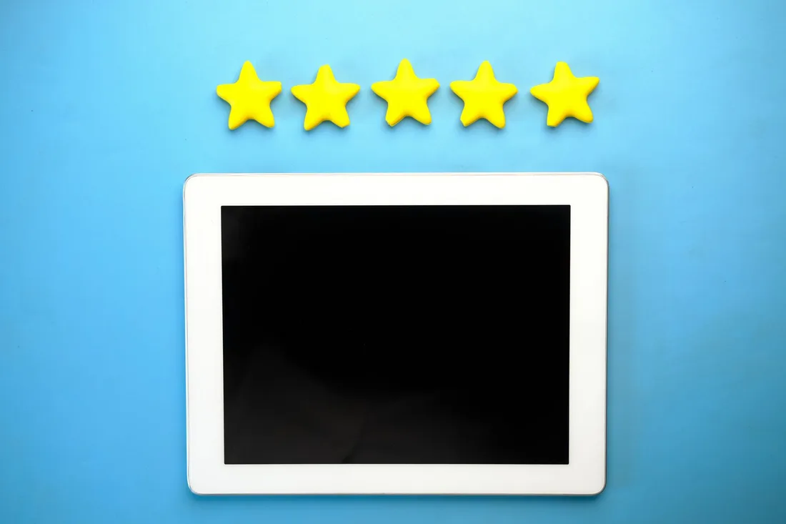 Five star rating shown on a tablet representing positive customer reviews. Photo by Towfiqu barbhuiya on Pexels