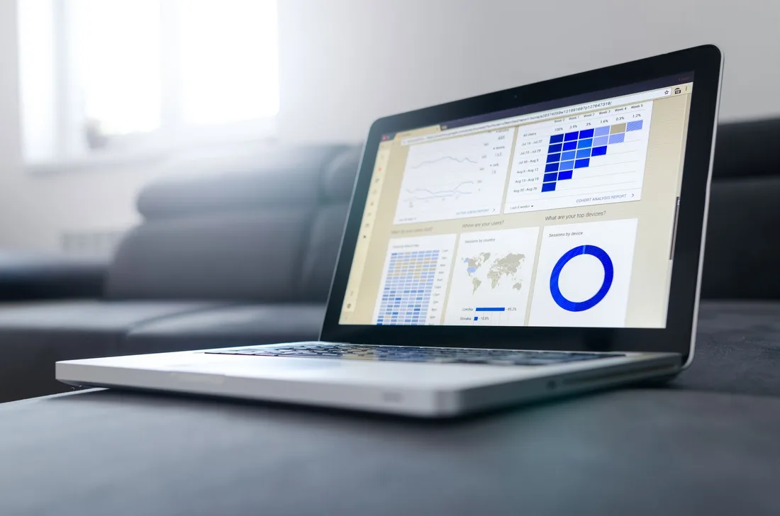Sleek laptop showcasing data analytics and graphs on the screen in a bright room. Photo by Lukas Blazek on Pexels