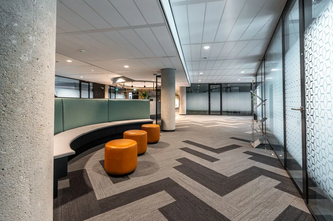 Bright modern office lobby with lounge seating and polished flooring. Photo by Mike van Schoonderwalt on Pexels