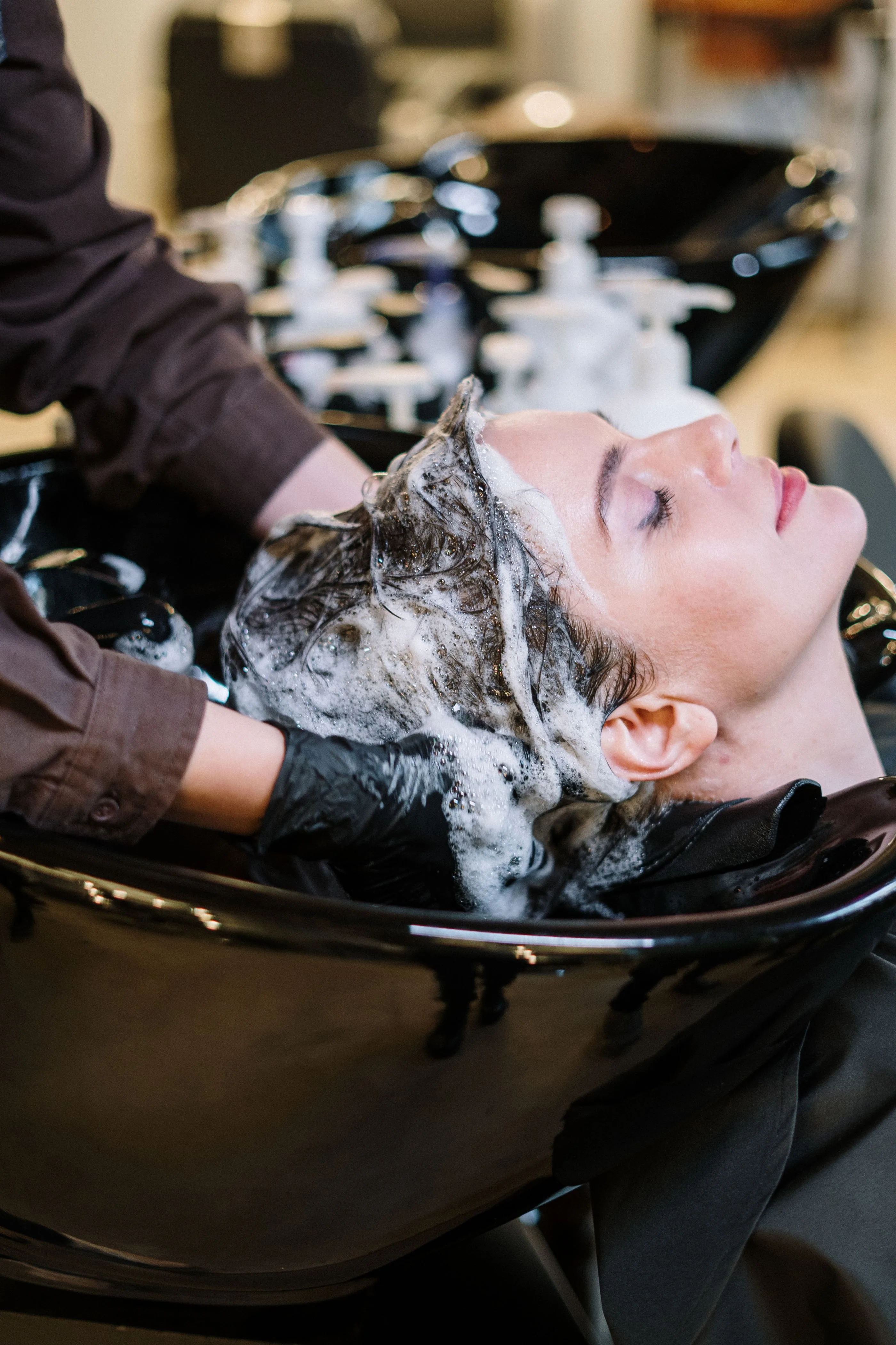 Hair specialist consultation in a modern studio. Photo by cottonbro studio on Pexels