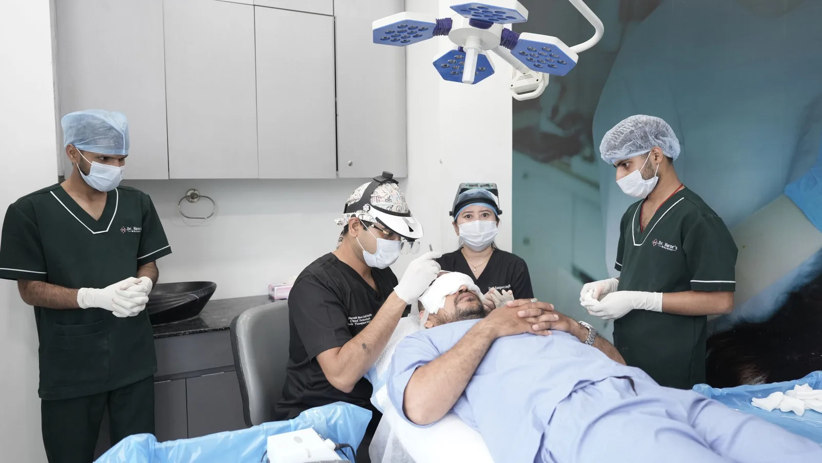 Surgical team in scrubs performing a hair transplant procedure on a patient in a clinic. Photo by Dr. Haror's  Wellness on Pexels