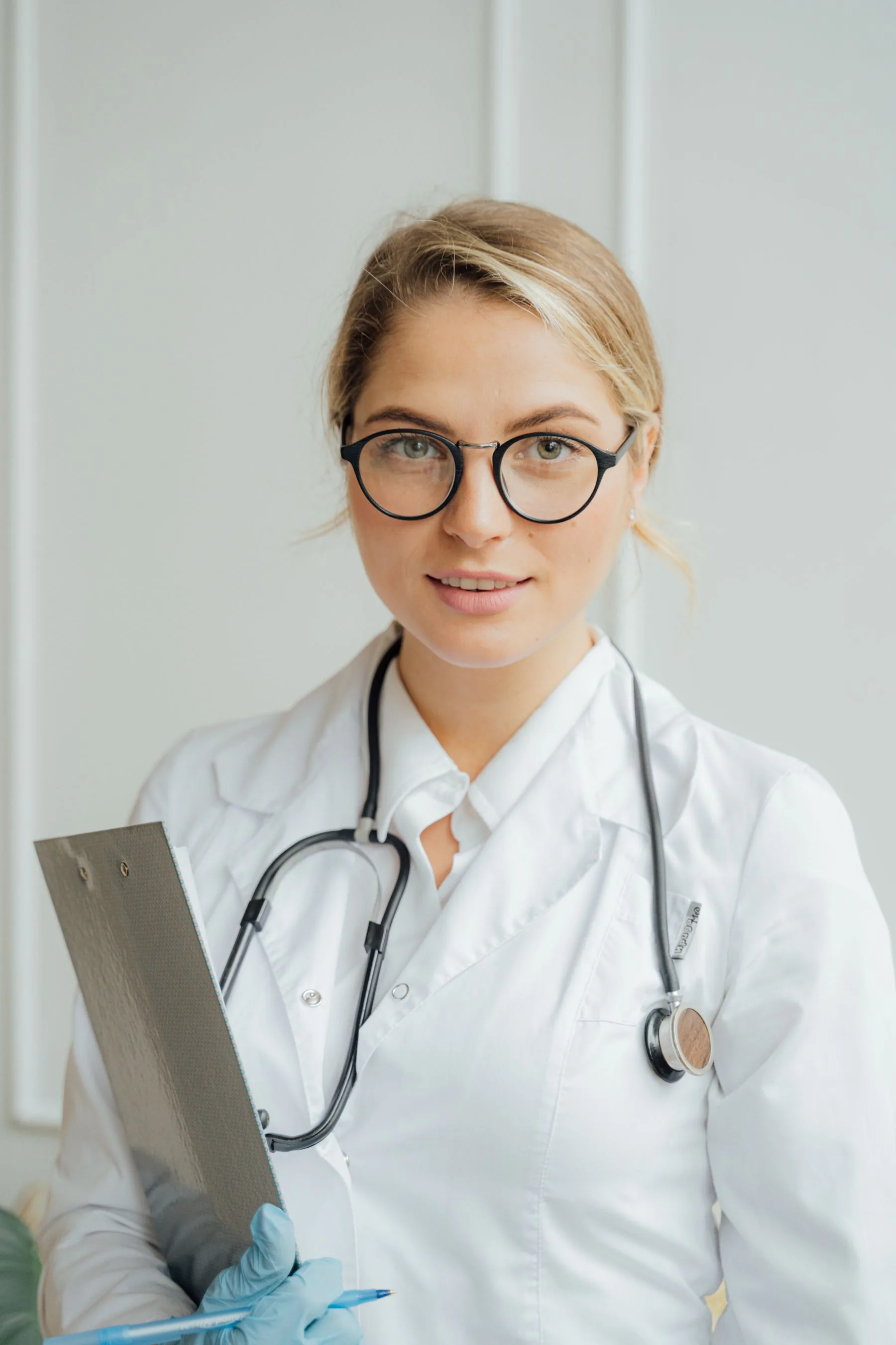 Clinic specialist with clipboard ready for consultation. Photo by AI25.Studio Studio on Pexels