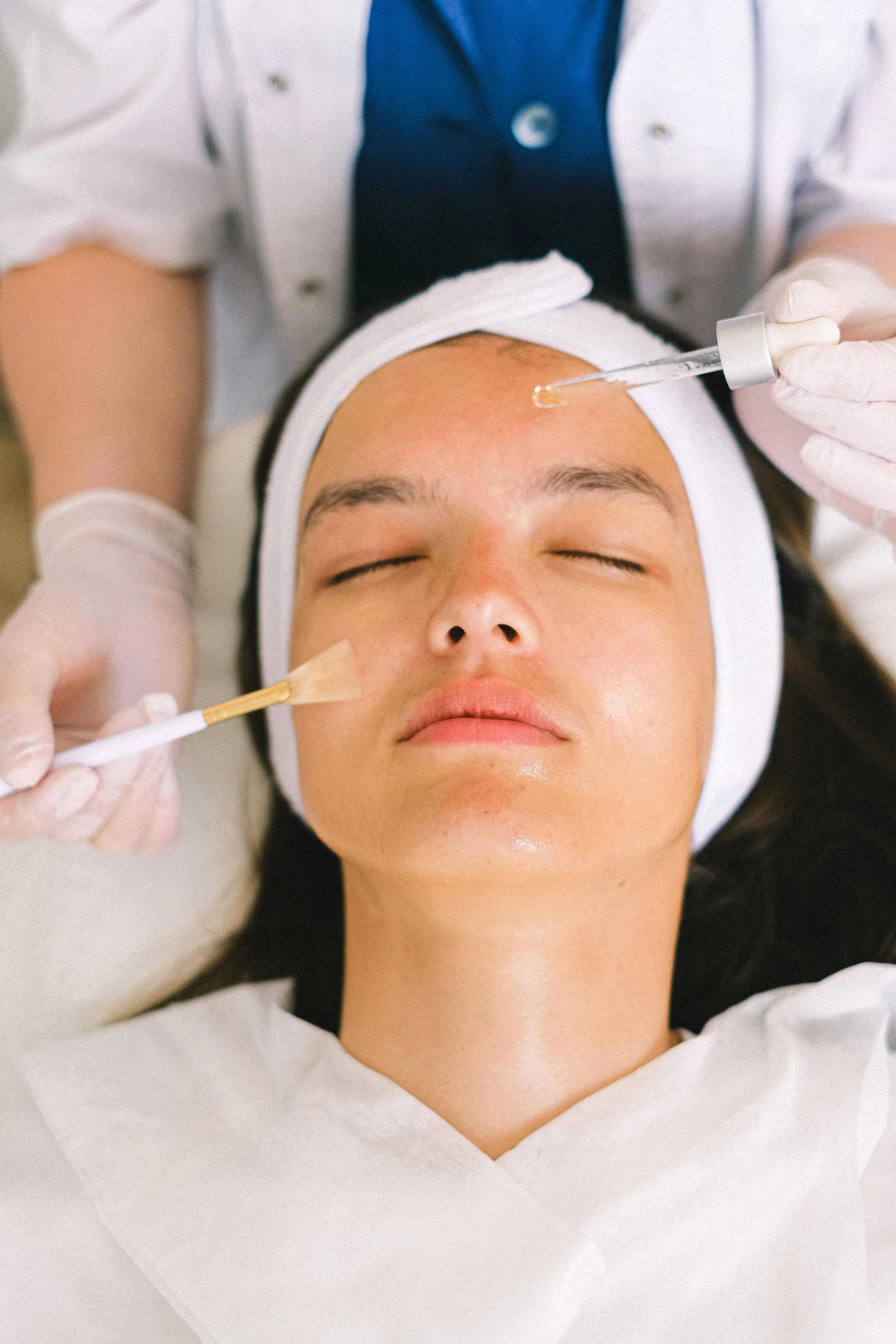Skin clinic specialist performing facial aesthetics care. Photo by Anna Shvets on Pexels