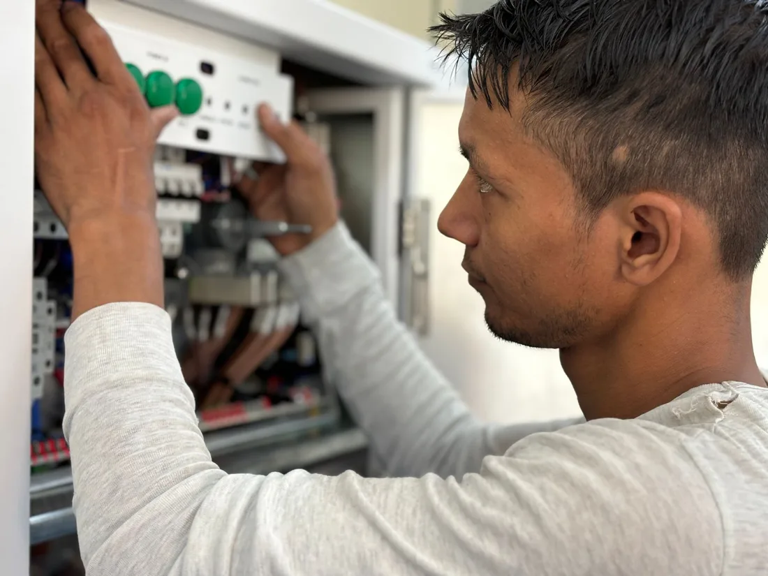 Focused electrician adjusting circuit breaker panel. Technology and skill in action. Photo by ranjeet . on Pexels