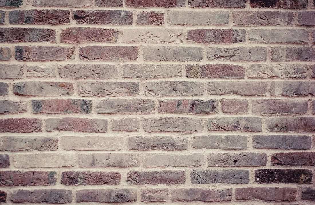 High-resolution vintage brick wall texture for backgrounds or wallpapers. Photo by Pixabay on Pexels