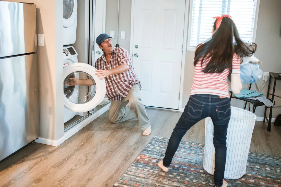 A man and woman doing laundry together in a modern home setting. Photo by RDNE Stock project on Pexels