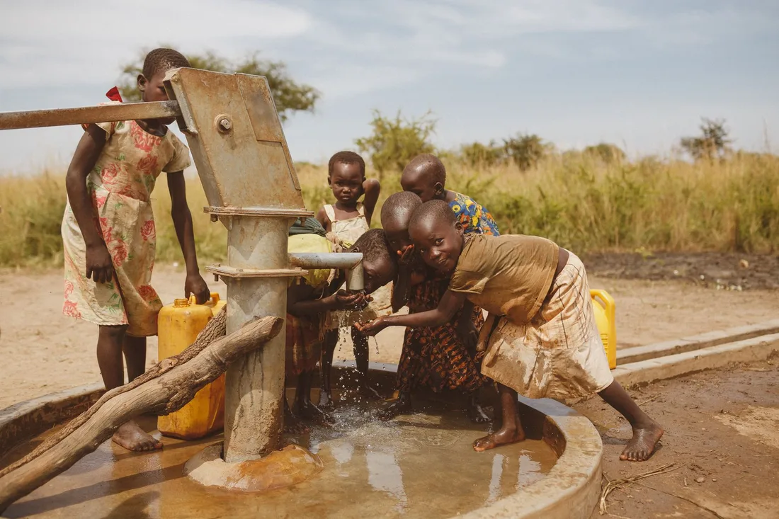 Group of children gathering water from a well in Kitgum, Uganda. Photo by illustrate Digital Ug on Pexels