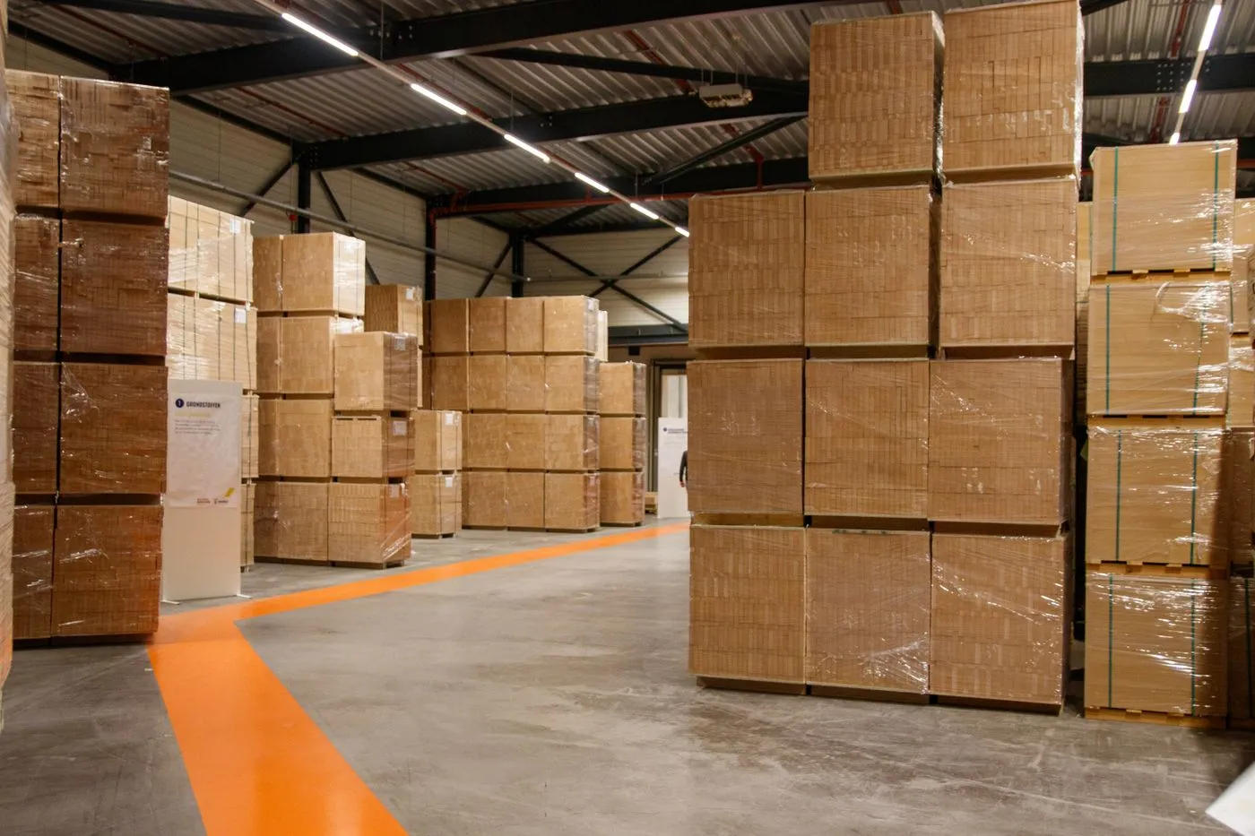 Stacked cardboard boxes in a packaging warehouse. Photo by Freek Wolsink on Pexels