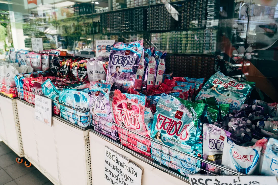 Colorful display of various laundry detergent brands in a retail store setting.. Photo by Markus Winkler on Pexels