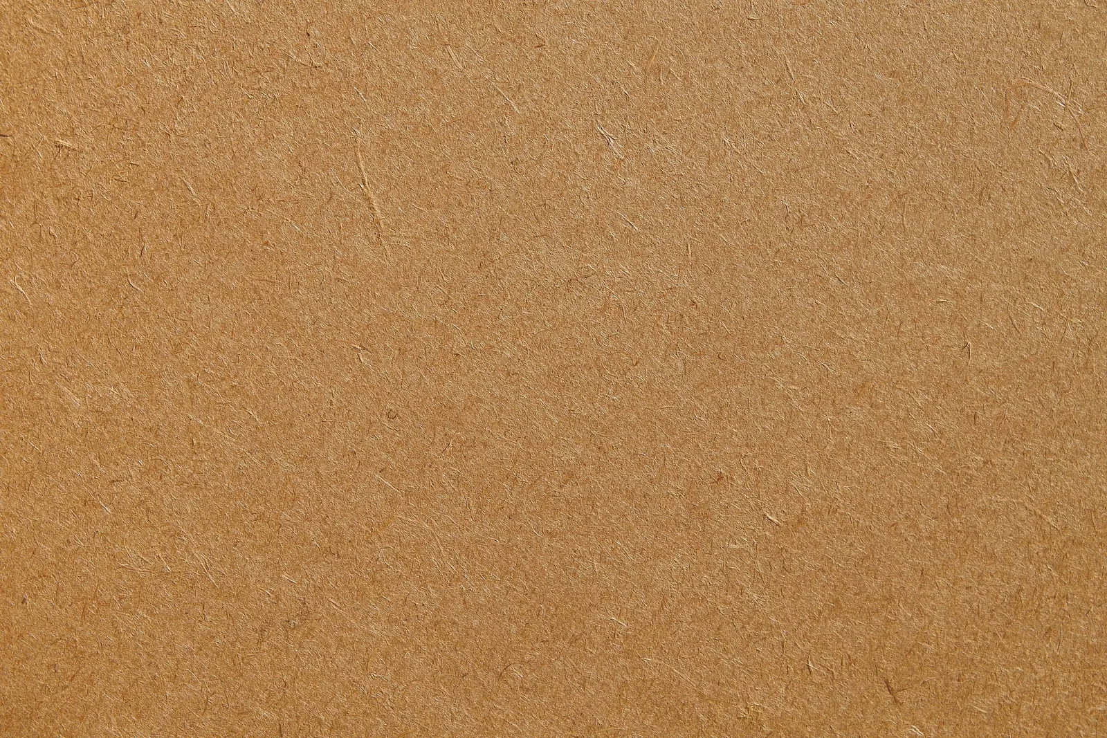 Detailed texture of a brown cardboard surface, ideal for backgrounds and design projects.. Photo by sergeispas on Pexels